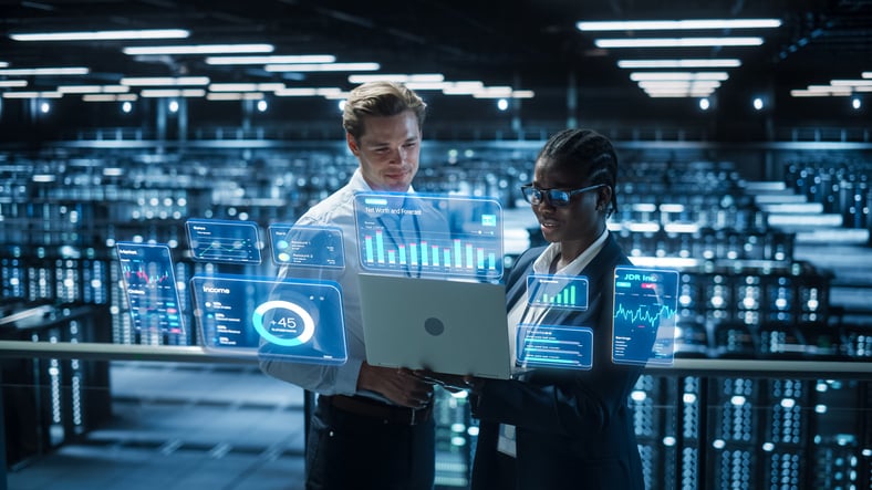 People working on digital technology and viewing dashboards