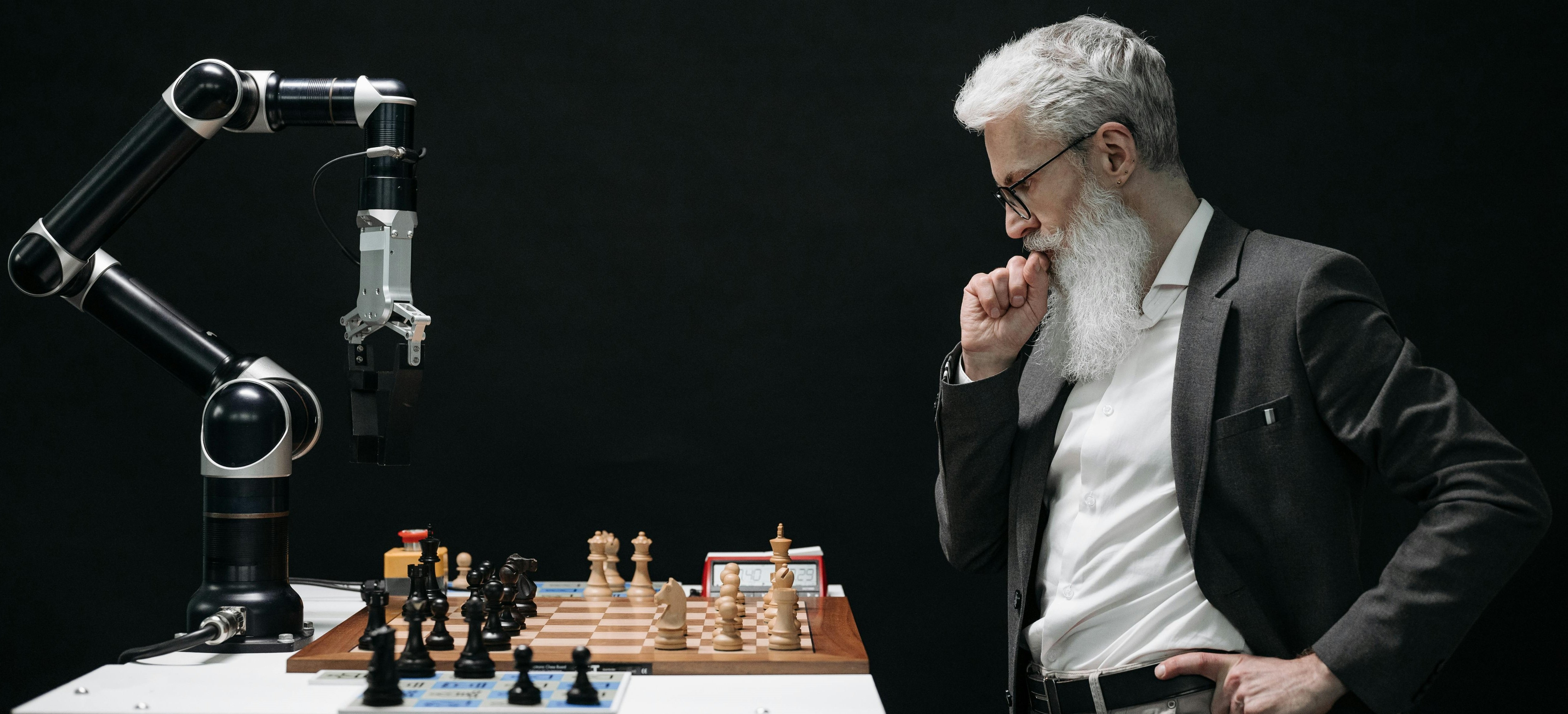 Image showing a human playing chess with a machine.