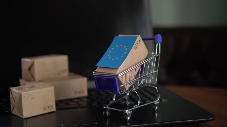 Image of boxes in a trolley and the flag of the EU on one box