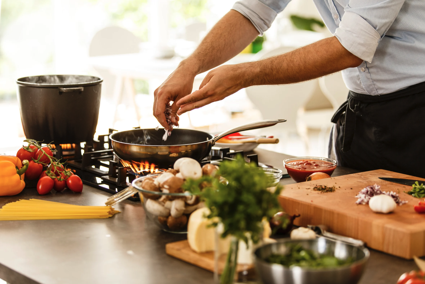 Preparing food on a chopping board with other ingredients in bowls