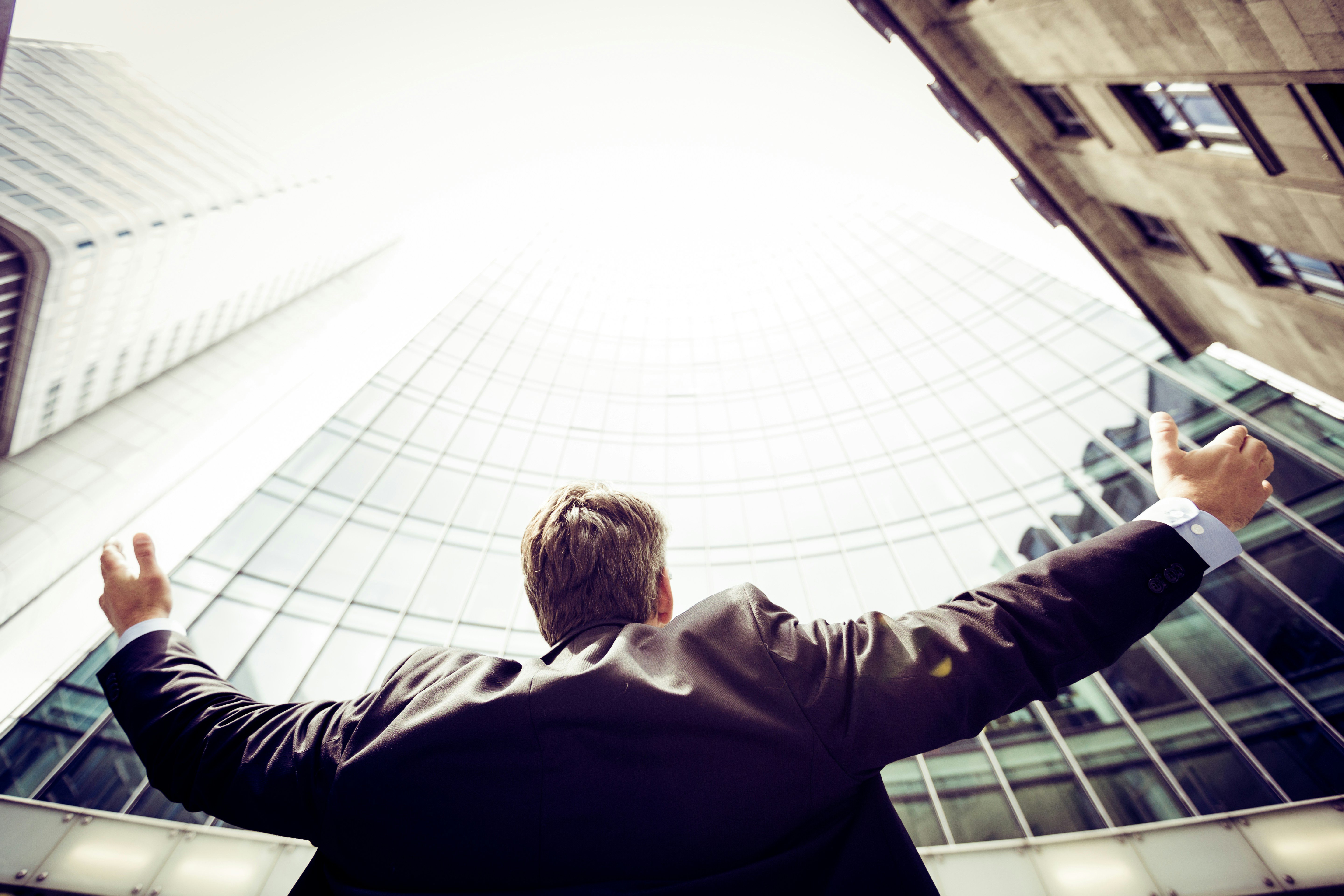 Image of an happy person in front of the office