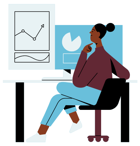 Person sitting at a desk reviewing graphs