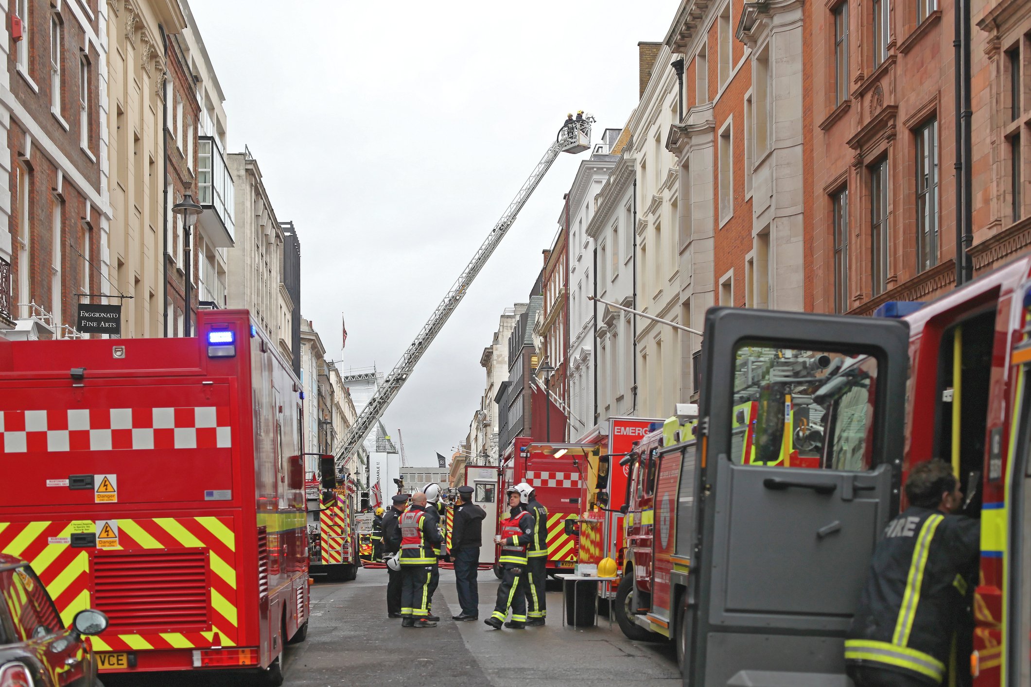Photo of fire engines and firefighters in a London street